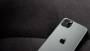 Grey iPhone 11 from a Telstra shop on a black background